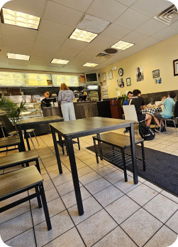 Inside the dining room with customers seated near the counter.